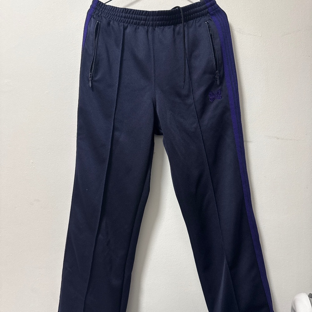 NEEDLES track pants